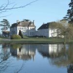 Brockencote Hall Hotel exterior overlooking a lake
