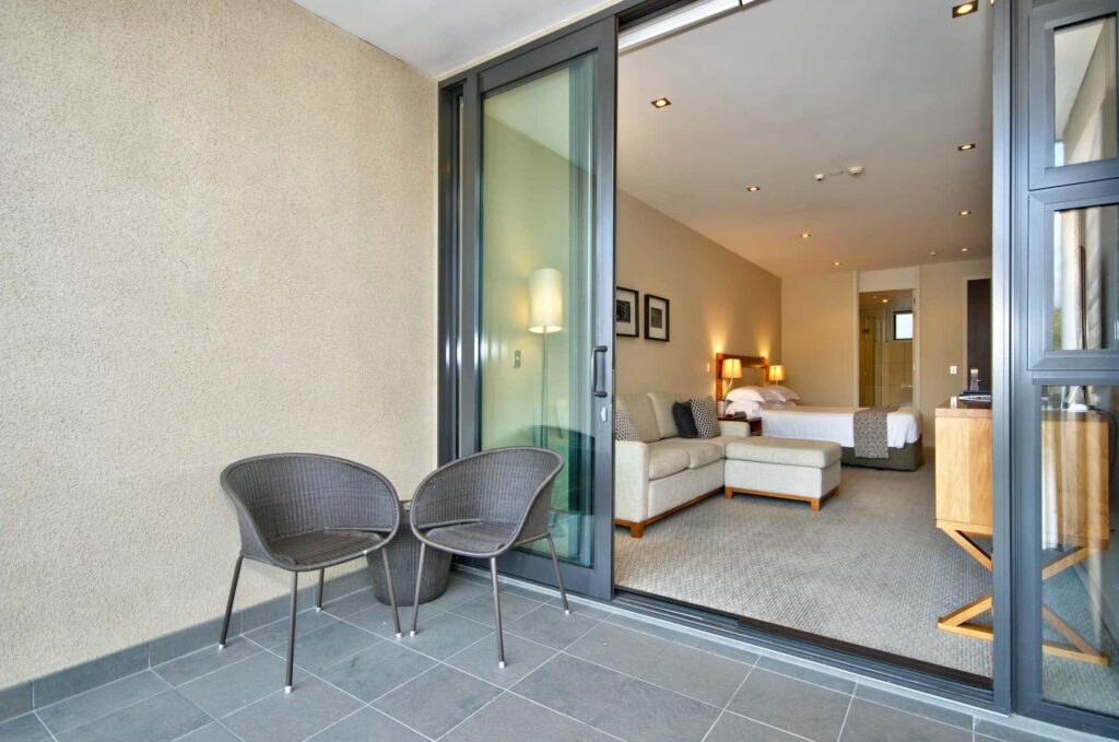 Lake View Hotel Room covered balcony with seating